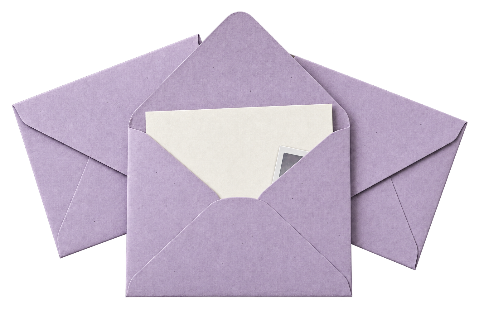 An open lavender envelope with a cream note and a Polaroid-style photograph tucked into its corner, resting on two matching envelopes.